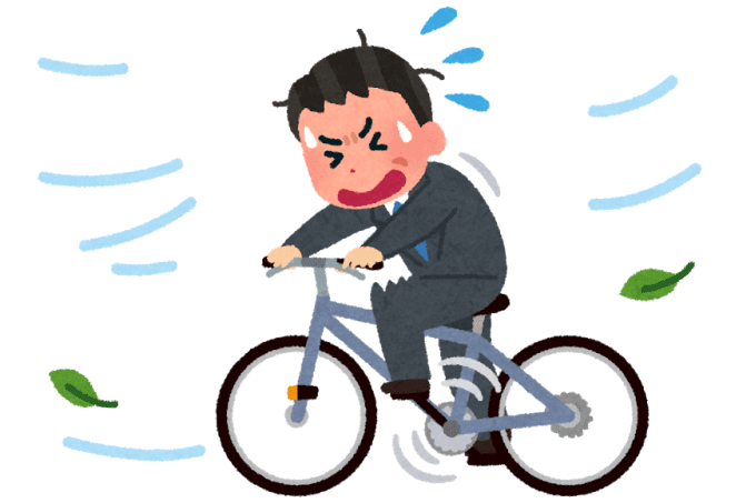 向かい風の中、自転車を漕ぐ男性のイラスト